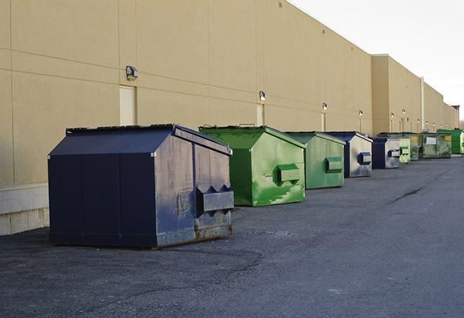 a group of dumpsters lined up along the street ready for use in a large-scale construction project in Batavia IL